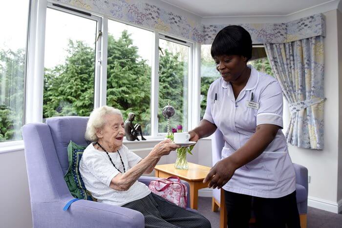 Care home resident reviewing financial documents