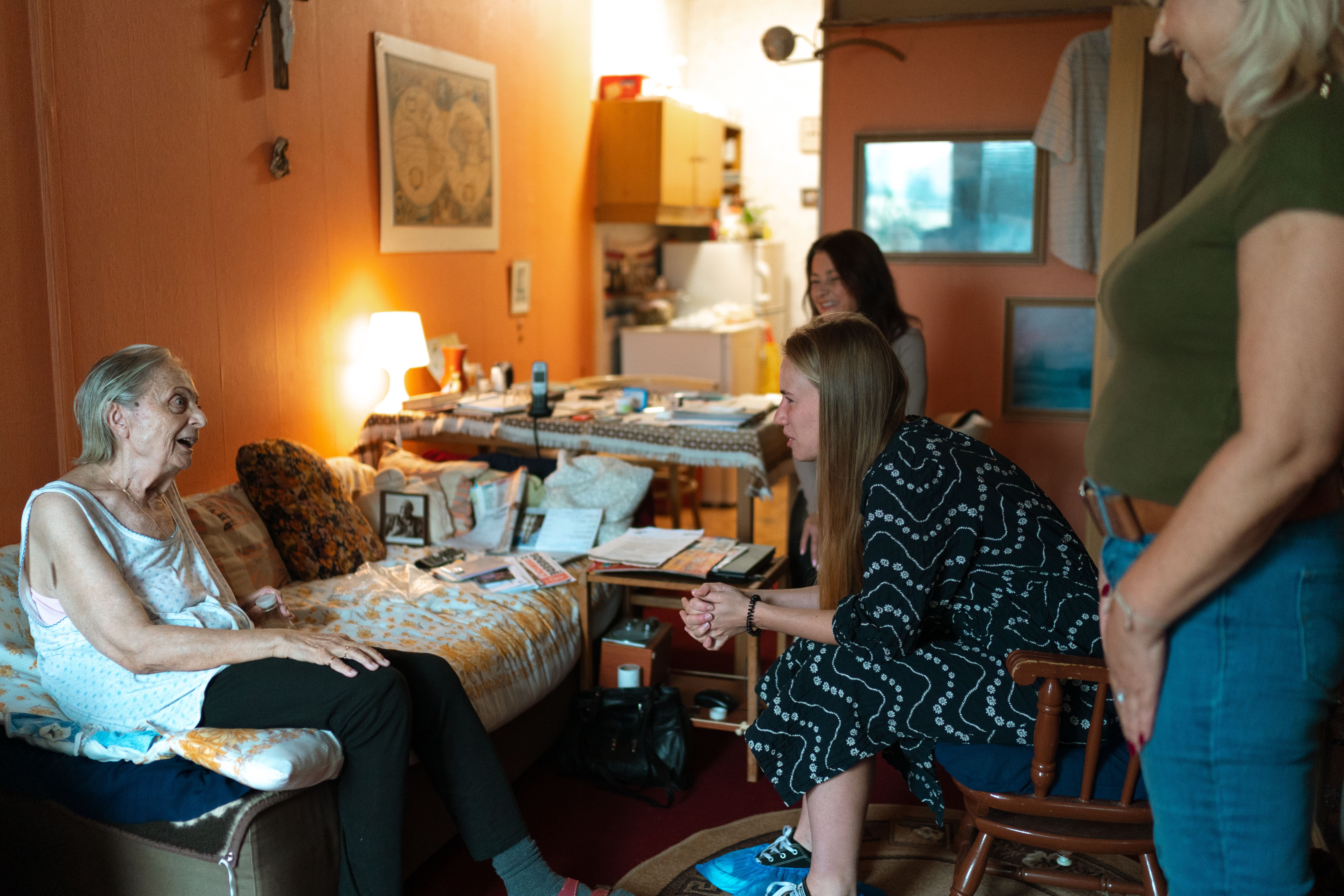 Family visiting an elderly relative in a care home