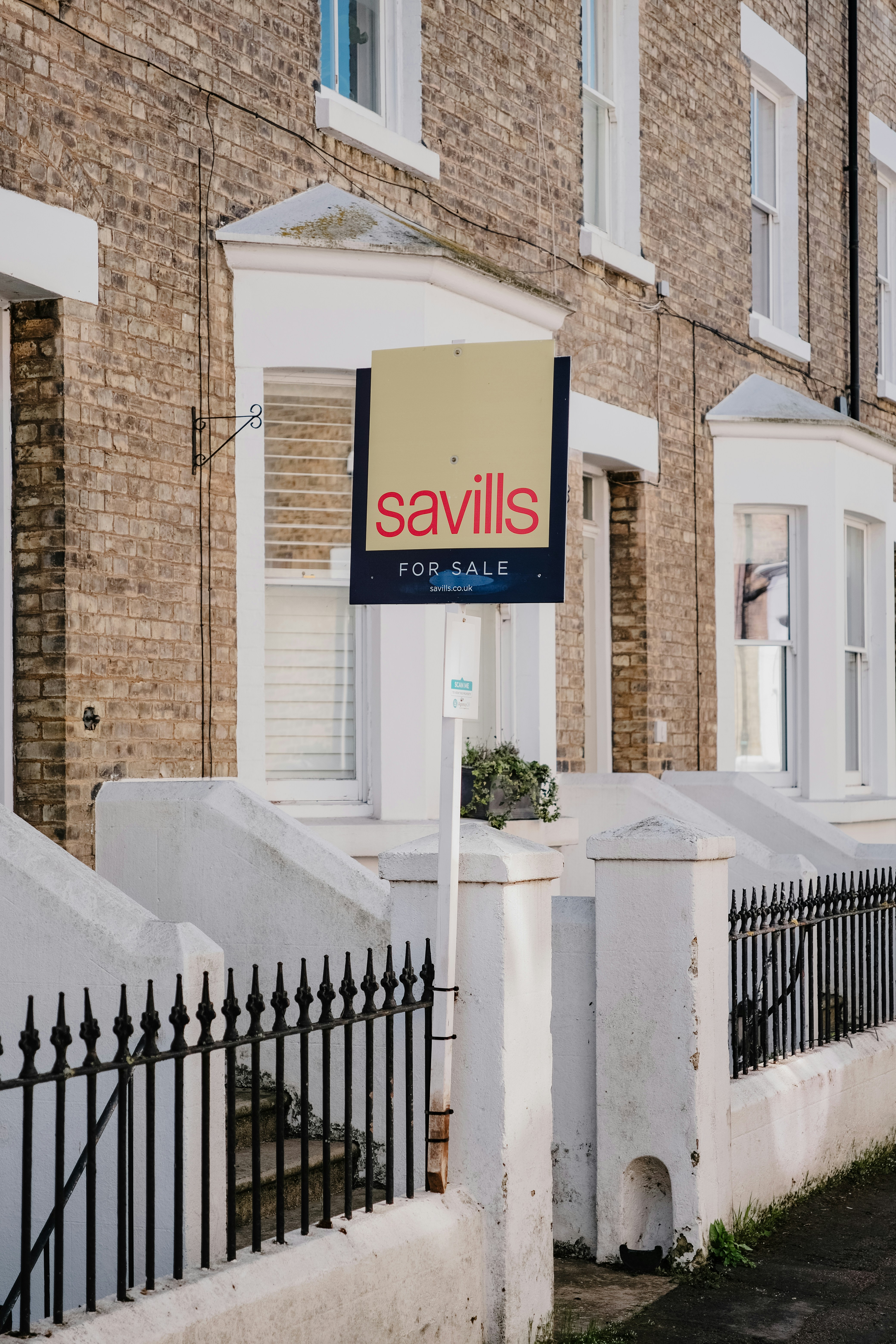 House exterior with for sale sign